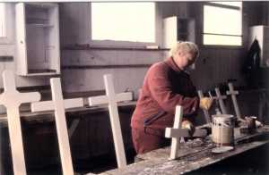 Sarah painting crosses in the Leith workshop